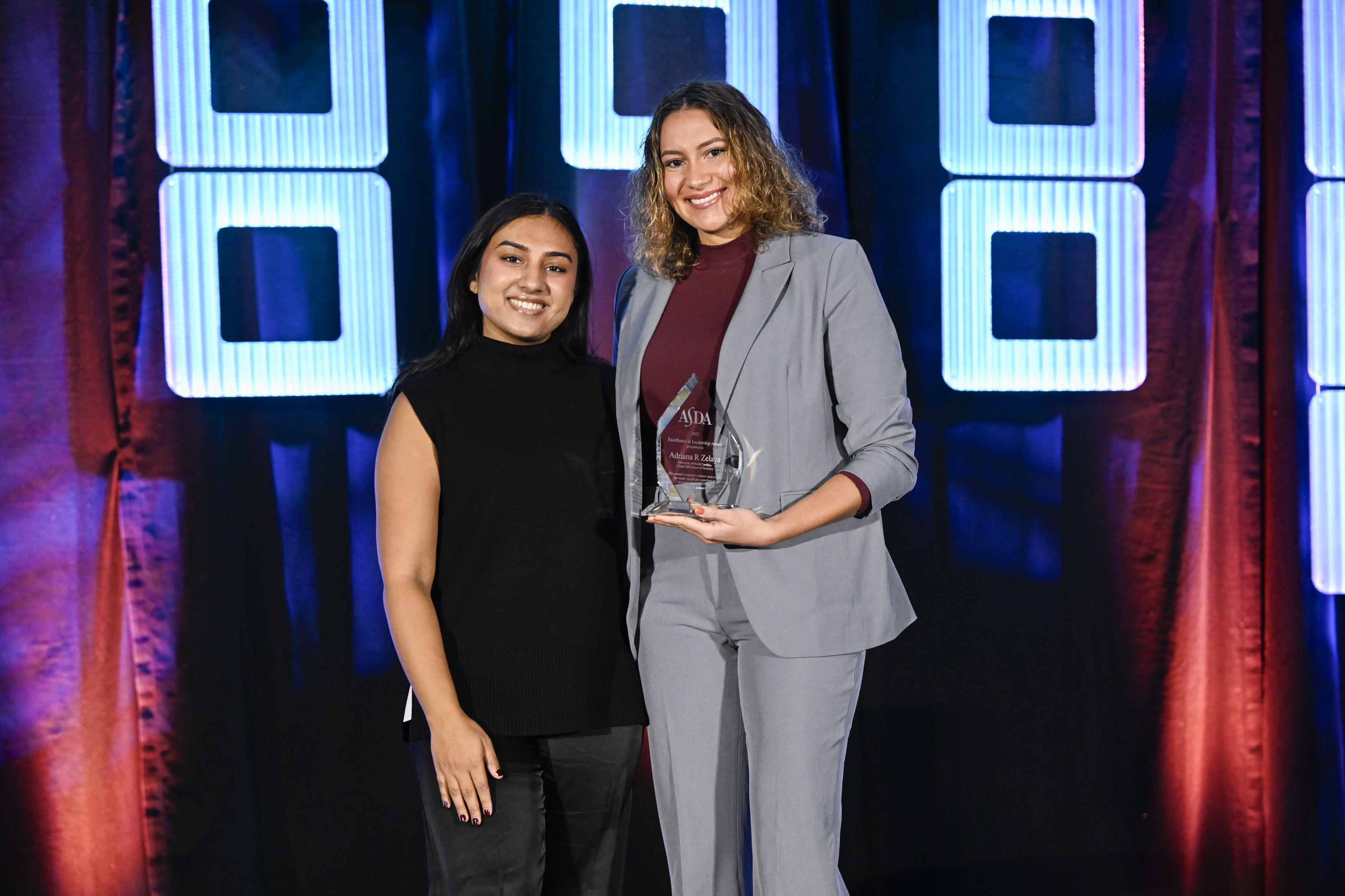 Adriana accepting award