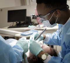A student volunteering their time and skills at Meharry’s Oral Health Day.